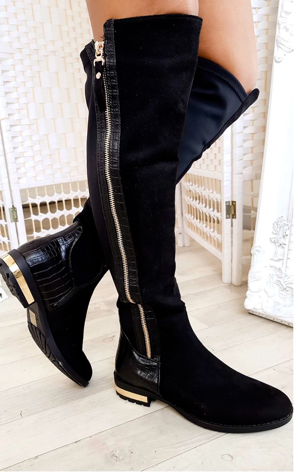 black over the knee boots with gold zipper